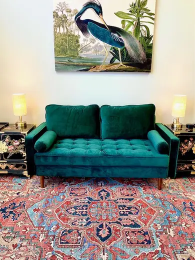 Cozy green sofa with artwork, Positive Recovery Centers - Sugar Land, intensive outpatient program in Galveston.