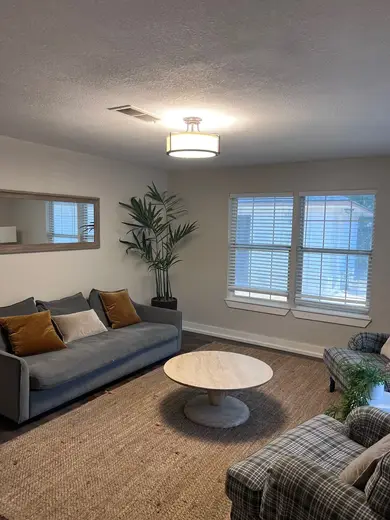 Cozy living room with modern decor at Taylor Recovery Sober Living, a sober living home in Galveston.