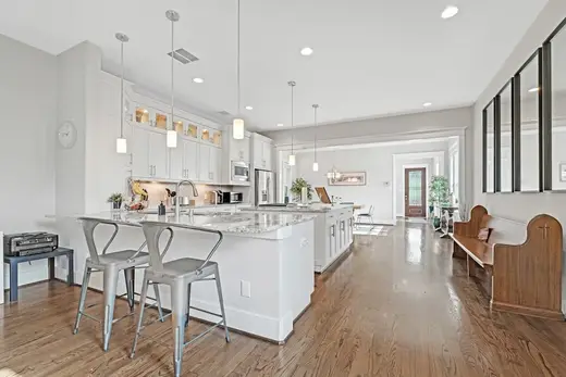 Modern kitchen with island at Bodine Recovery, a luxury sober living home in Galveston.