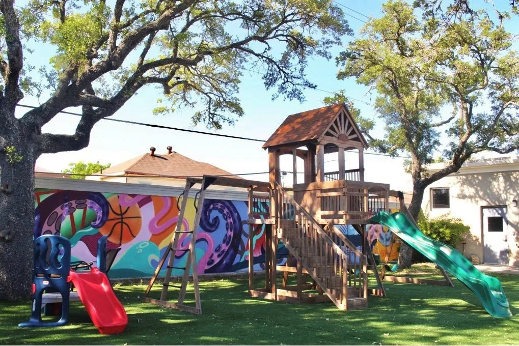 Exterior view of Galveston sober living home — outdoor play equipment