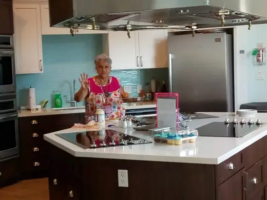 Bright modern kitchen with island at Ronald McDonald House sober living home in Galveston.